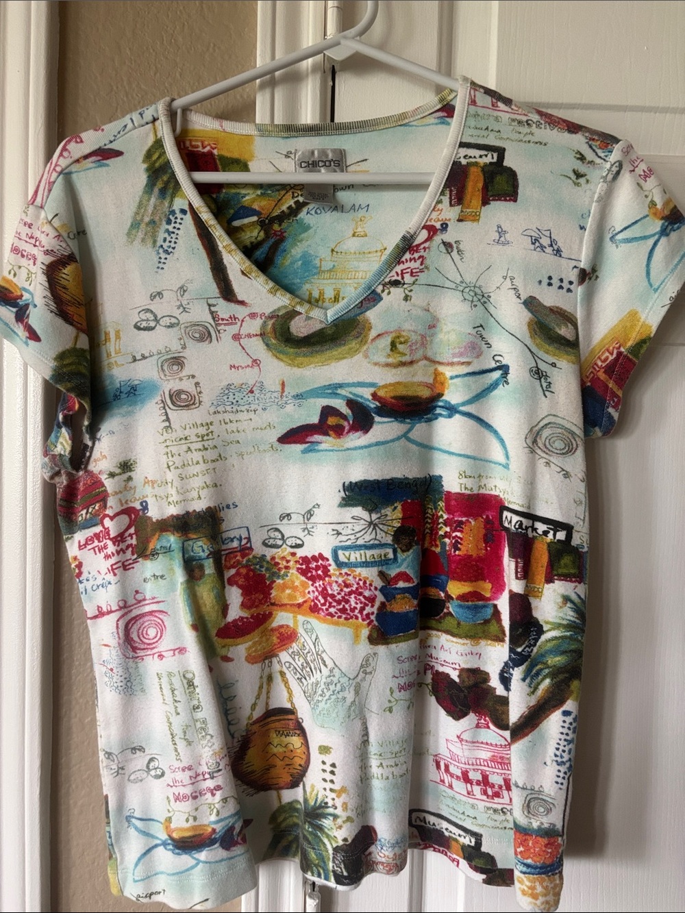 Chico's White V‑Neck Short Sleeve Top with Multicolor Travel Print